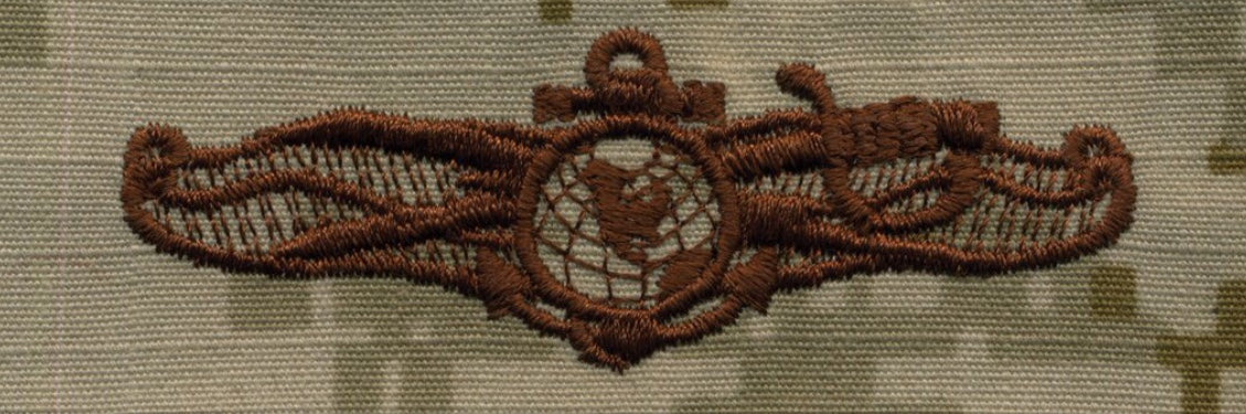NWU Type II Warfare Devices & Breast Insignia Officer